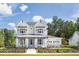 Two story farmhouse style home with landscaping at 1180 Reserve Ln, Awendaw, SC 29429