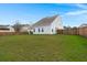 Large backyard with a spacious grassy area at 514 Morelets Dr, Moncks Corner, SC 29461