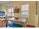 Charming dining area with a wooden table and blue bench at 204 Michigan Ave # D2, Folly Beach, SC 29439