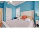 Comfortable bedroom with light blue walls and a queen-size bed at 204 Michigan Ave # D2, Folly Beach, SC 29439