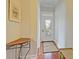 Light-filled entryway with hardwood floors and small table at 204 Michigan Ave # D2, Folly Beach, SC 29439