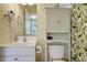 Small bathroom with white vanity, toilet and shower at 204 Michigan Ave # D2, Folly Beach, SC 29439