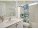 Clean bathroom with white vanity, toilet and shower/tub combo at 204 Michigan Ave # D2, Folly Beach, SC 29439
