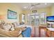 Comfortable living room with hardwood floors and sliding glass doors to balcony at 204 Michigan Ave # D2, Folly Beach, SC 29439