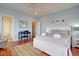 Bedroom with light blue walls, king bed, and en-suite bathroom at 204 Michigan Ave # D2, Folly Beach, SC 29439