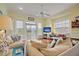 Spacious living area with hardwood floors, comfy seating, and access to balcony at 204 Michigan Ave # D2, Folly Beach, SC 29439
