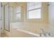 Bathroom with a large soaking tub and walk in shower at 204 Michigan Ave # D2, Folly Beach, SC 29439