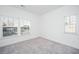 Spacious bedroom with gray carpeting and multiple windows at 211 Cache Ct # 6, Charleston, SC 29414