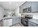 Modern kitchen with gray cabinets and stainless steel appliances at 211 Cache Ct # 6, Charleston, SC 29414
