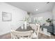 Dining area with a dark wood table and white chairs at 211 Cache Ct # 6, Charleston, SC 29414