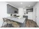 Modern kitchen boasts granite countertops and gray cabinets at 211 Cache Ct # 6, Charleston, SC 29414