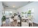 Open concept dining area with wood flooring and a view of the living room at 211 Cache Ct # 6, Charleston, SC 29414