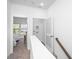Upstairs hallway with doors to bedrooms and laundry area at 211 Cache Ct # 6, Charleston, SC 29414