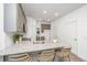 Granite kitchen island with seating, gray cabinets and stainless appliances at 211 Cache Ct # 6, Charleston, SC 29414