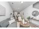 Open living room features a gray sofa, coffee table, and stylish decor at 211 Cache Ct # 6, Charleston, SC 29414