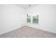 Simple bedroom with gray carpeting and a window with blinds at 211 Cache Ct # 6, Charleston, SC 29414