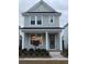 Two-story house with gray siding, dark green door, and landscaping at 331 Trailmore Ln, Summerville, SC 29486