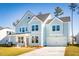 Two-story light blue house with white accents, gray roof, and a two-car garage at 172 Belfort Pl, Summerville, SC 29486