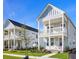 Two story light gray houses with pink door and balcony at 341 Trailmore Ln, Summerville, SC 29486