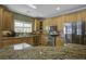 Modern kitchen with stainless steel appliances and granite countertops at 443 Lazy Hill Rd, Moncks Corner, SC 29461