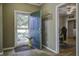 Bright entryway with tile flooring and coat rack at 443 Lazy Hill Rd, Moncks Corner, SC 29461