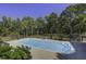 Sparkling in-ground pool with a spacious patio and comfortable seating at 443 Lazy Hill Rd, Moncks Corner, SC 29461