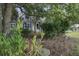 Landscaped side yard with a stone path at 443 Lazy Hill Rd, Moncks Corner, SC 29461