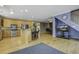 Open concept kitchen and living room with hardwood floors and island at 443 Lazy Hill Rd, Moncks Corner, SC 29461
