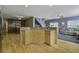 Large kitchen island with granite countertop and hardwood floors at 443 Lazy Hill Rd, Moncks Corner, SC 29461