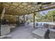Covered patio with seating, outdoor kitchen, and pool views at 443 Lazy Hill Rd, Moncks Corner, SC 29461