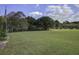Open grassy backyard offering privacy and outdoor enjoyment at 443 Lazy Hill Rd, Moncks Corner, SC 29461