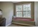 Charming window seat with a red cushion offers a cozy reading nook at 443 Lazy Hill Rd, Moncks Corner, SC 29461