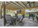 Outdoor dining area under covered patio with grill at 443 Lazy Hill Rd, Moncks Corner, SC 29461