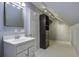 Bathroom with white vanity, a large mirror, and a walk-in closet at 443 Lazy Hill Rd, Moncks Corner, SC 29461