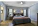 Bright bedroom with hardwood floors and ensuite bathroom access at 443 Lazy Hill Rd, Moncks Corner, SC 29461