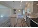 Open concept kitchen with granite countertops and white cabinets at 168 Willow Ct, Walterboro, SC 29488