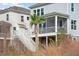 Gray house with white trim, deck, and palm tree at 1627 Siloh Drive Dr # 481, Mount Pleasant, SC 29466