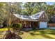 Front exterior view of a brick and siding home with front porch and landscaping at 1212 O T Wallace Blvd, Moncks Corner, SC 29461