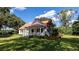 White farmhouse with a red metal roof and a spacious front porch at 0 Tuten Road, Round O, SC 29474