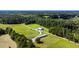 Aerial view of a property with farm buildings and open fields at 0 Tuten Road, Round O, SC 29474