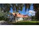 Charming white farmhouse with a red metal roof and landscaping at 0 Tuten Road, Round O, SC 29474
