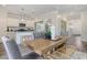 Open concept dining room with kitchen and hardwood floors at 205 Torslanda Ln, Summerville, SC 29486