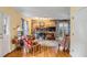 Living room with brick fireplace, hardwood floors, and French doors at 52 Hasell St, Charleston, SC 29401