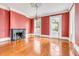 Large living room with hardwood floors, fireplace, and high ceilings at 52 Hasell St, Charleston, SC 29401