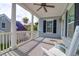 Spacious covered porch overlooking the neighborhood; features a ceiling fan at 627 Cloudbreak Ct, Charleston, SC 29412