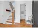 Bright entryway with hardwood floors, staircase and powder room at 627 Cloudbreak Ct, Charleston, SC 29412