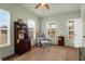 Home office with built-in shelving, comfortable seating, and natural light at 627 Cloudbreak Ct, Charleston, SC 29412