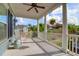 Relaxing covered porch with rocking chair, white columns, and neighborhood views at 627 Cloudbreak Ct, Charleston, SC 29412