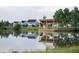 Peaceful pond with a wooden gazebo and houses in the background at 210 Denham St, Summerville, SC 29486