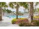 Inviting community pool with palm trees and seating at 1010 Lovebug Ln, Summerville, SC 29485